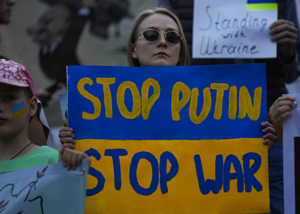 A Ukrainian woman takes part in a demonstration marking the one year anniversary of the Russian invasion of Ukraine, in Mexico City, Friday, Feb. 24, 2023. Source: AP Photo/Fernando Llano
