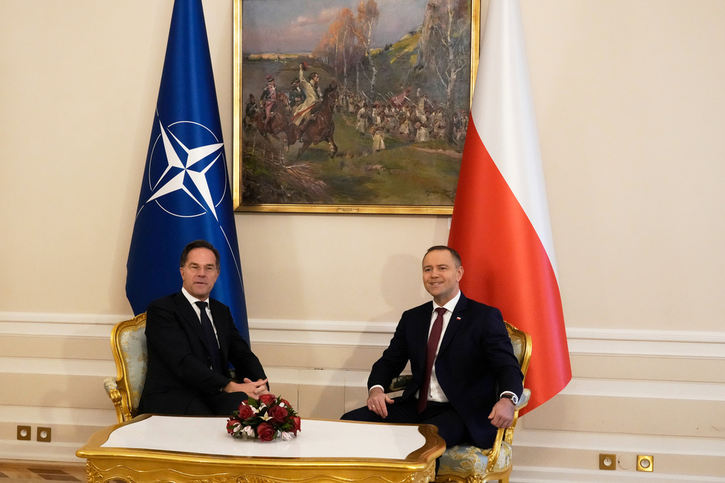 Poland's President Karol Nawrocki, right, sits with NATO Secretary General Mark Rutte during talks  in Warsaw, Poland,  Dec. 18, 2025. Source: AP