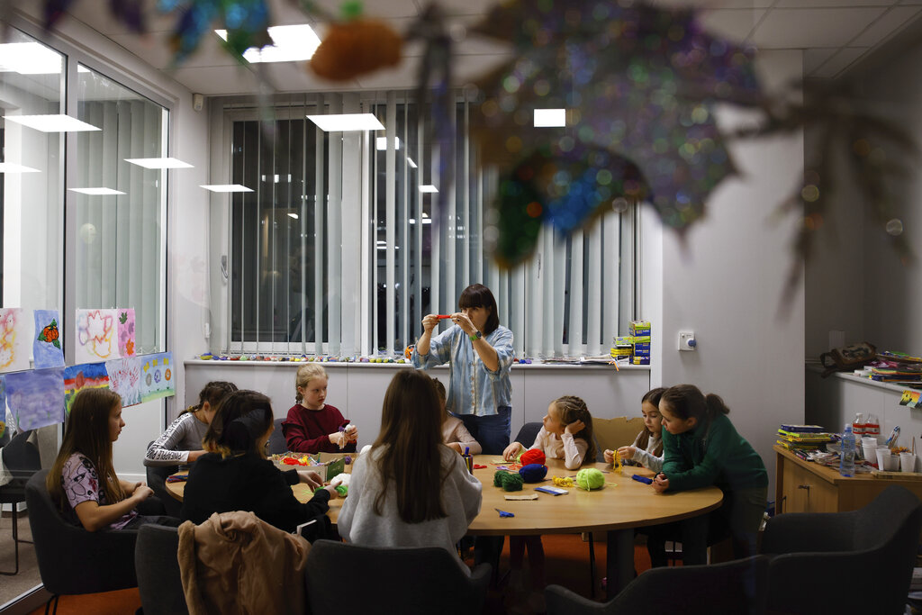Ukrainians spend time at the UNICEF facility in Warsaw, Poland. Source: AP