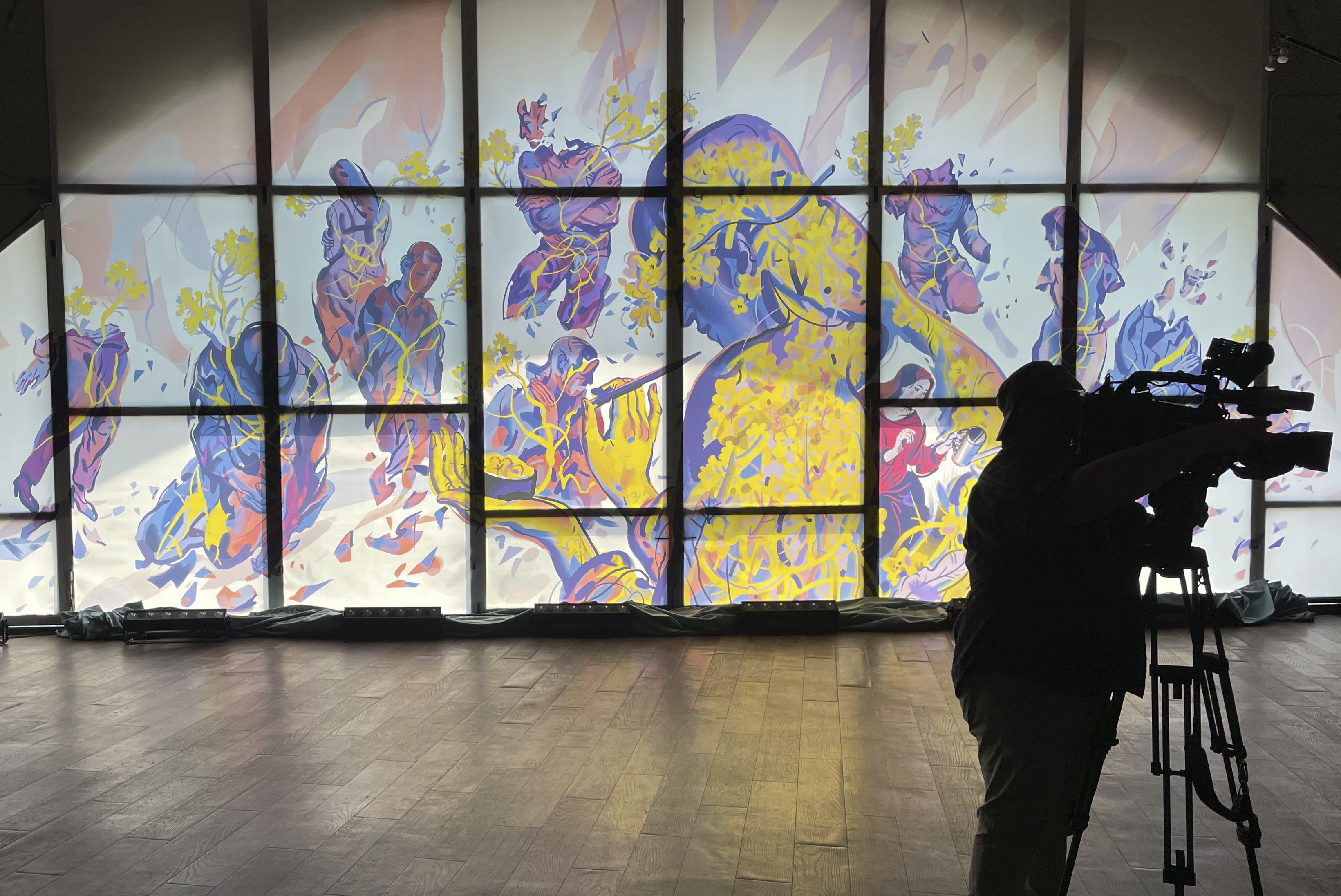 A man stands next to artwork by the Ukrainian artist Julia Tveritina to raise awareness for the victims of sexual assault, at an art center in Kyiv, Ukraine, on Wednesday, June 19, 2024. Authorities announced the creation of a national registry to document cases of sexual violence allegedly committed by Russian forces Source: AP photo.