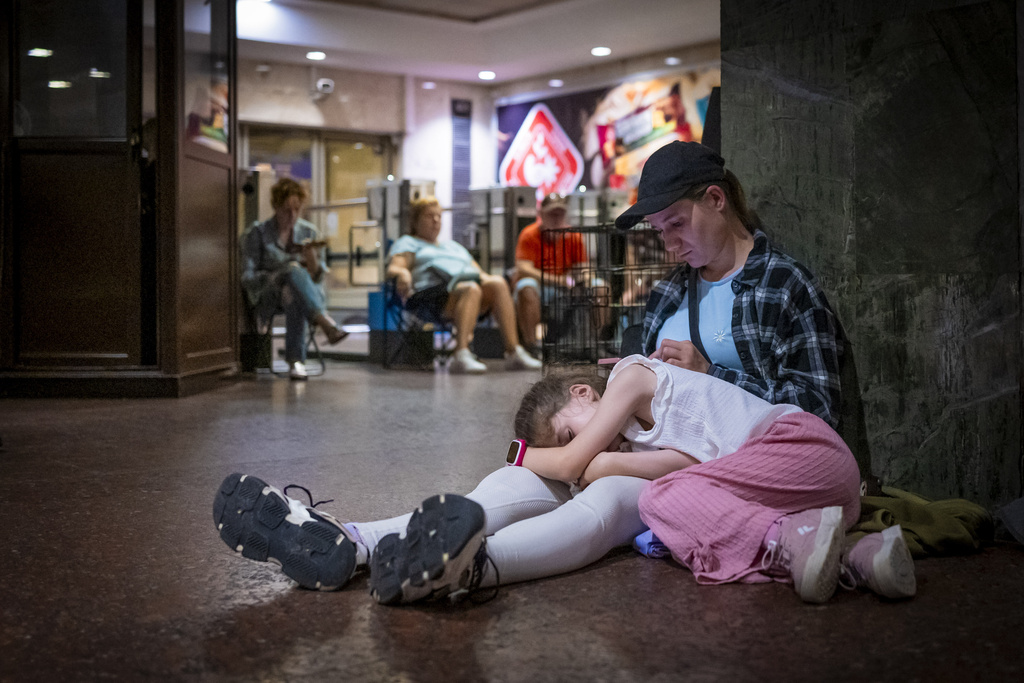 People rest in a metro station, being used as a bomb shelter, during a Russian missile attack in Kyiv, Ukraine, Thursday, July 31, 2025. Source: AP Photo/Dan Bashakov