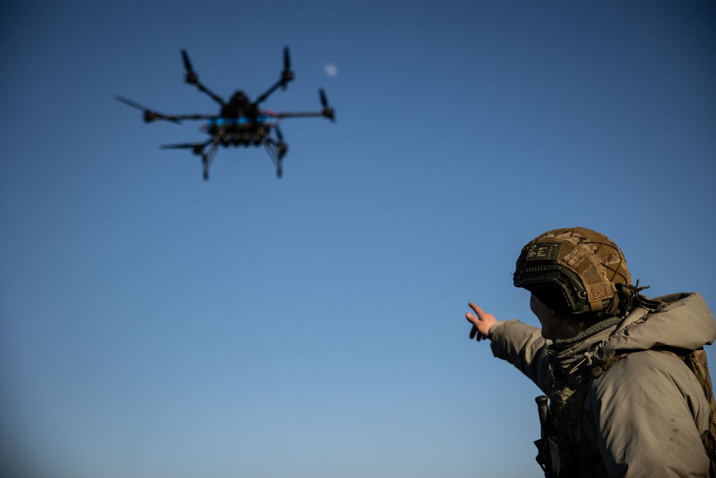 Photo: Ukrainian soldier points a finger at drone Vampire in flight at training area on February 8, 2025 in Donetsk Oblast, Ukraine. Donetsk Oblast. Source: AP