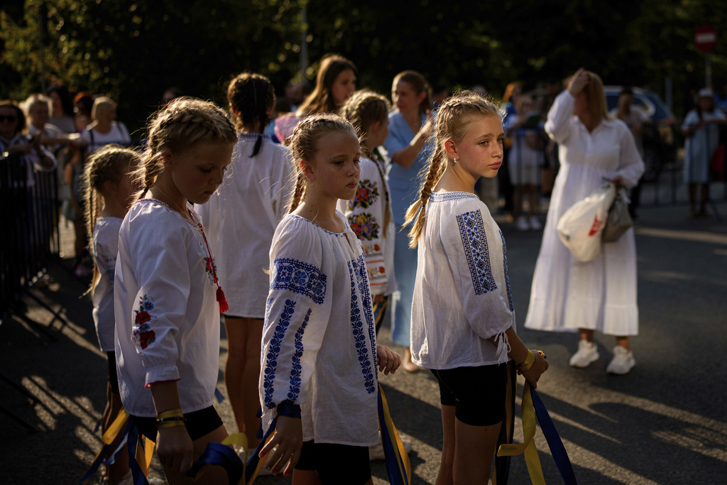 Children of a Ukrainian dance group prepare to perform during an event held to show solidarity with Ukraine, marking its upcoming Aug. 24 Independence Day, in Bucharest, Romania. Source: AP Photo/Andreea Alexandru