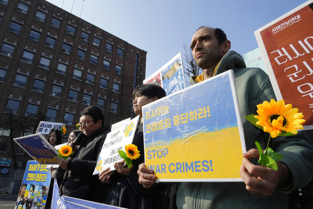 Protesters attend a rally to mark the one-year anniversary of Russia's invasion of Ukraine, near the Russian Embassy in Seoul, South Korea, Friday, Feb. 24, 2023. Source: AP Photo/Ahn Young-joon