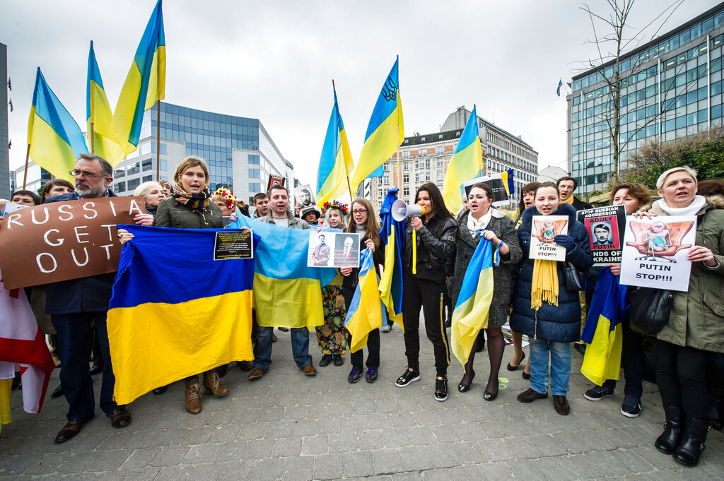 Pro-Ukrainian activists protest outside the EU Council in Brussels on March 17, 2014, as EU foreign ministers discuss sanctions on individuals linked to Russia’s annexation of Crimea following a disputed referendum. Source: Geert Vanden Wijngaert/AP