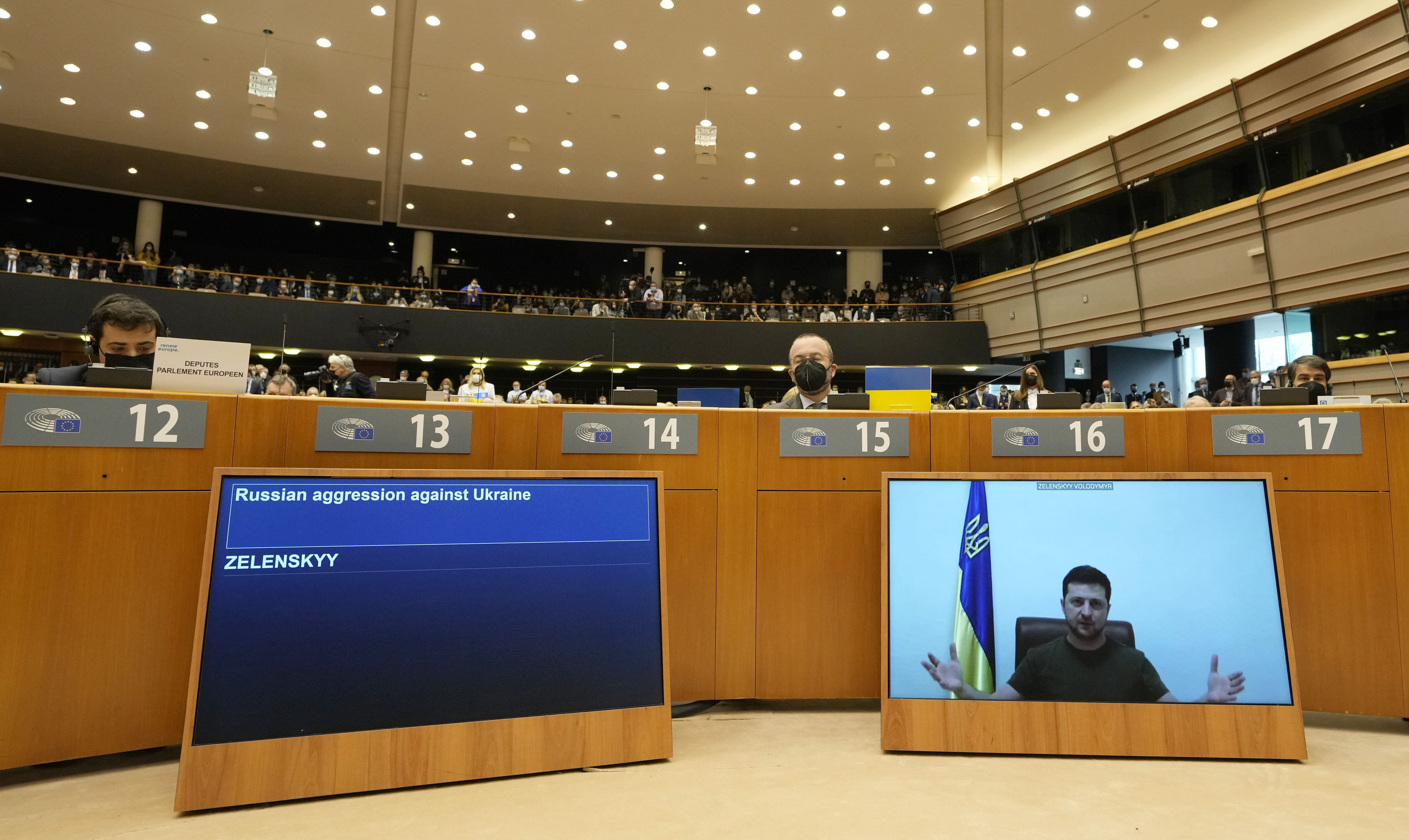 Ukraine's President Volodymyr Zelenskyy addresses the Plenary, via remote link, during an extraordinary session on Ukraine at the European Parliament in Brussels, March 1, 2022. European Union leaders gather in Versailles for a two-day summit focusing on the war in Ukraine. Their nations have been fully united in backing Ukraine’s resistance with unprecedented economic sanctions, but divisions have started to surface on how fast the bloc could move in integrating Ukraine and severing energy ties with Moscow. Source: Virginia Mayo, AP.