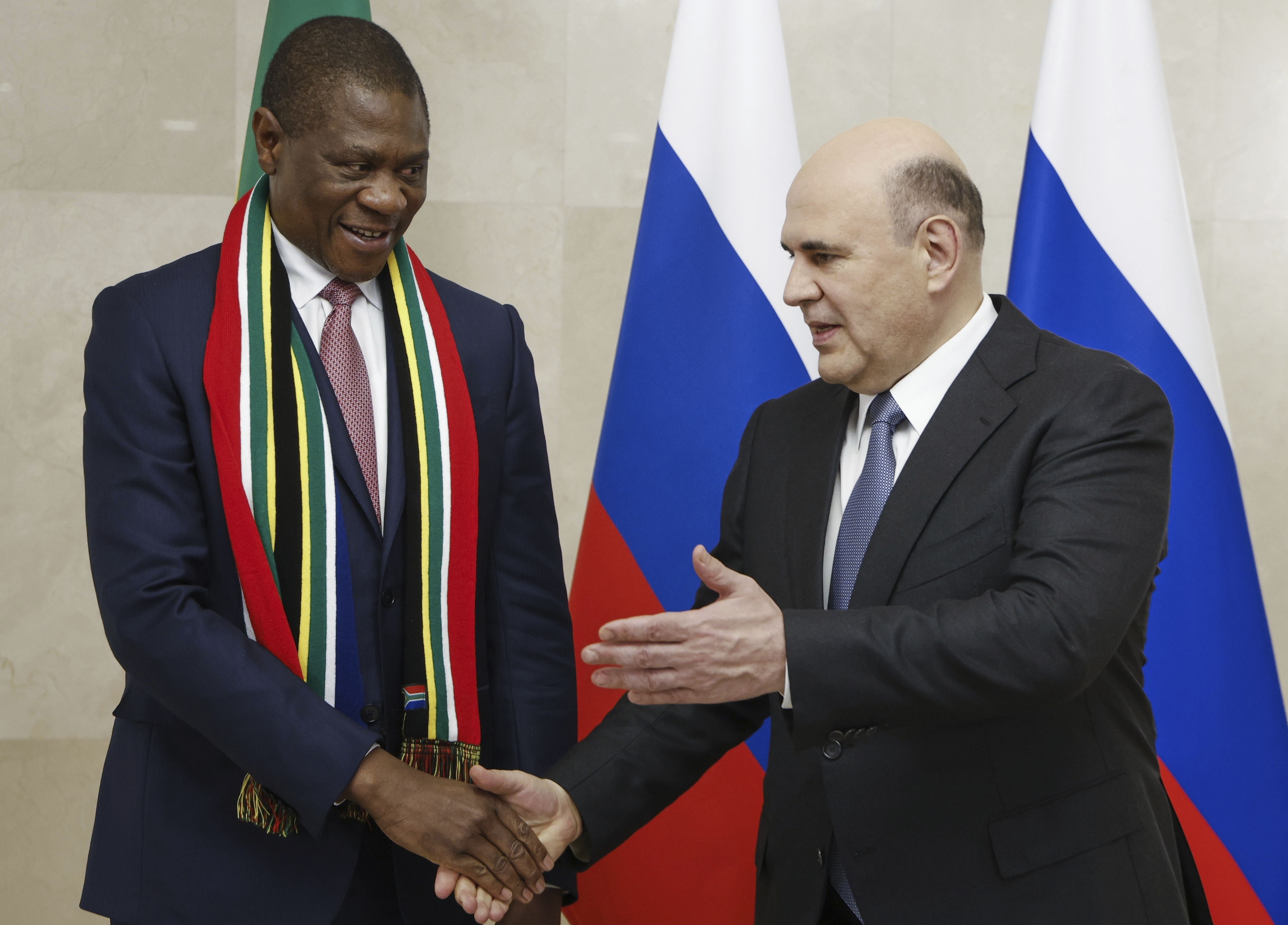 Russian Prime Minister Mikhail Mishustin, right, and Deputy President of South Africa, Paul Mashatile, left, shake hands during a meeting in Moscow, Russia, Wednesday, June 18, 2025. Source: Government Pool, AP